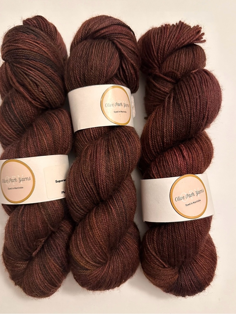OlivePark Yarns Hand-Dyed Wool Skeins deep red and brown tones merino sock